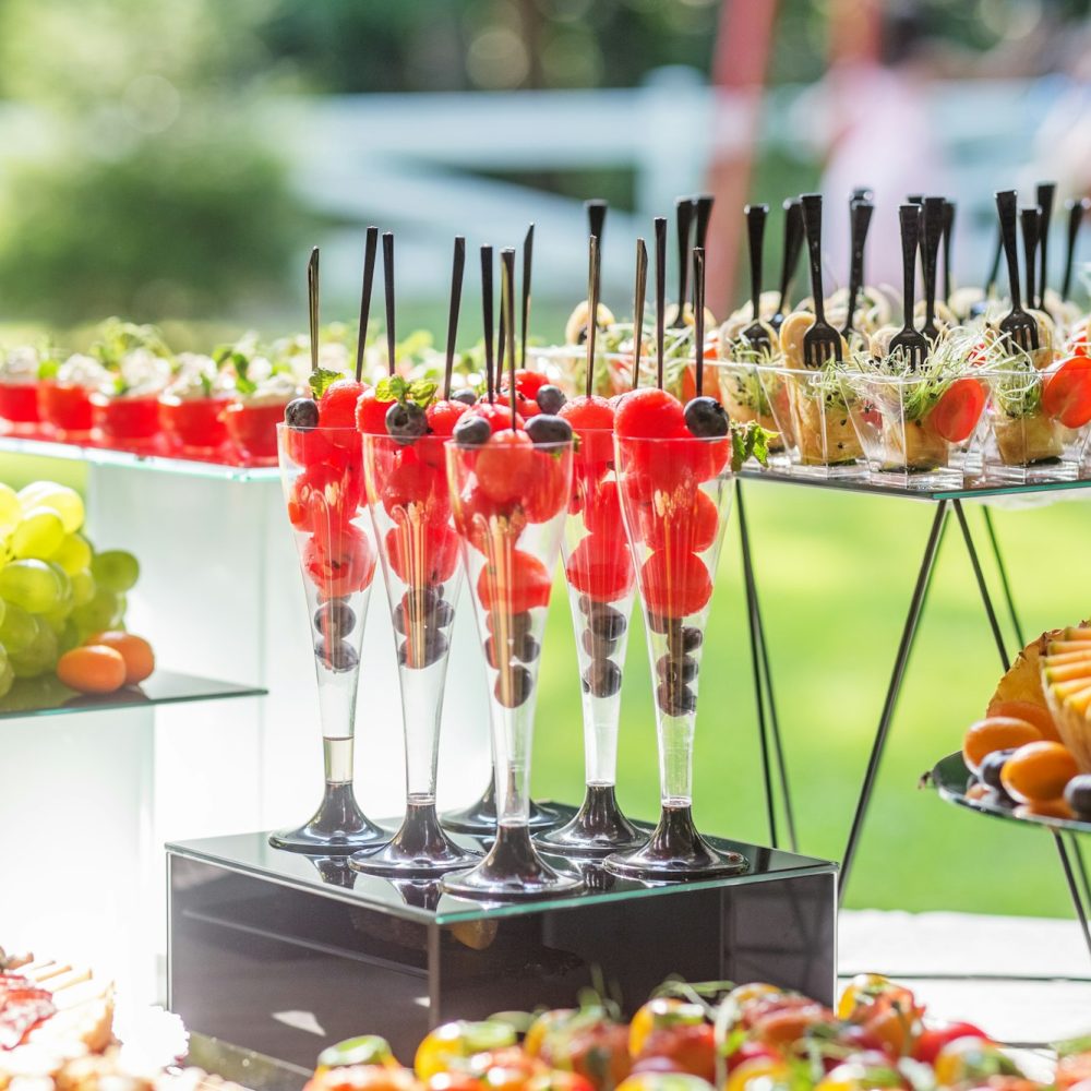 catering buffet table with snacks and appetizers.